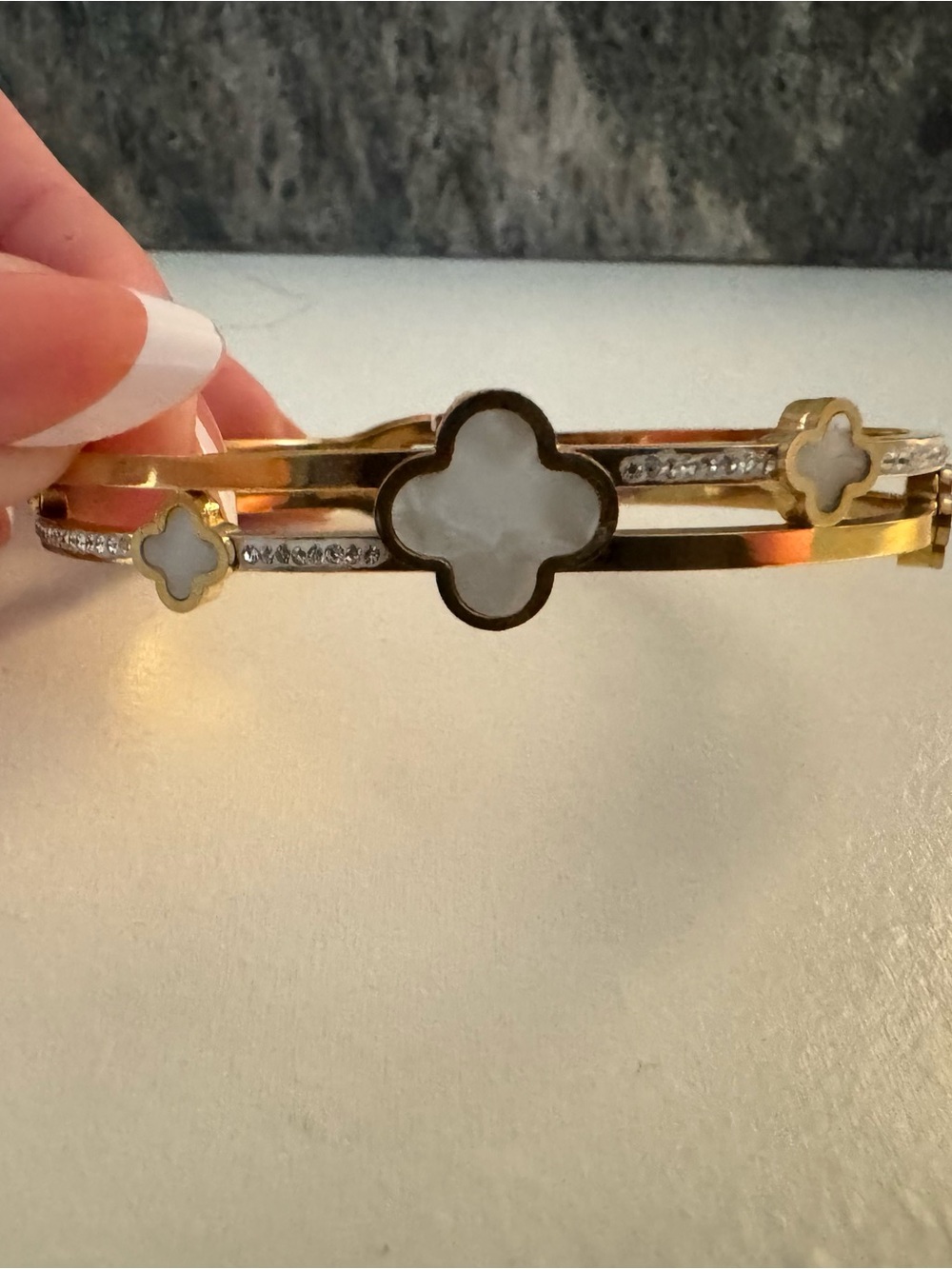 Goldtone Clover Bangle Bracelet with White Inlay and Crystal Accents
